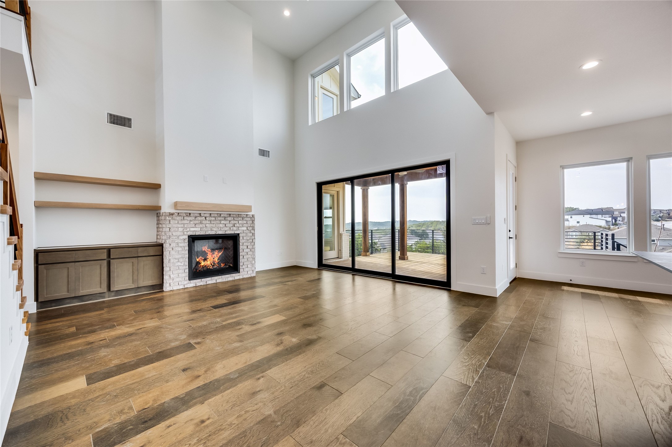 288 Smoke Tree Circle Dripping Springs, TX 78620 - Photo 6 of 40 a view of an empty room with window and fire place