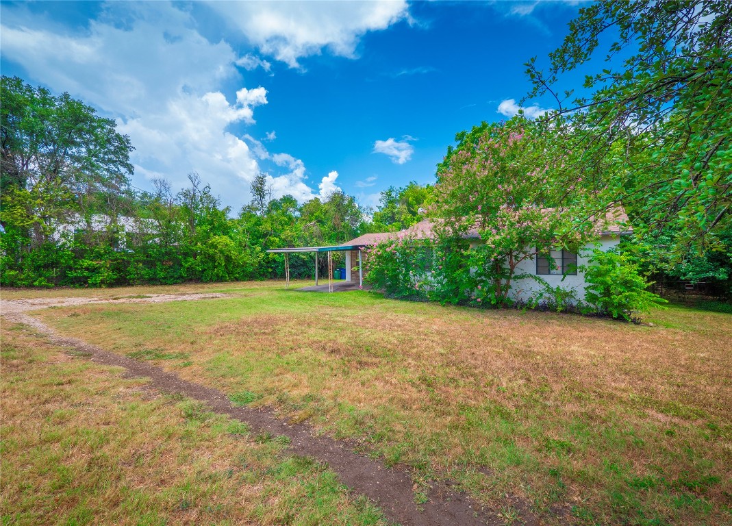1806 Fortview Road Austin, TX 78704 - Photo 13 of 26 a view of a field with trees in the background