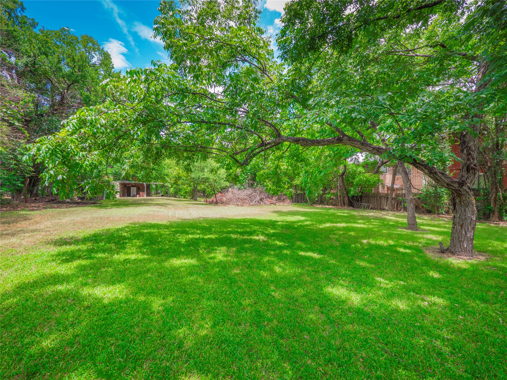 1806 Fortview Road Austin, TX 78704 - Photo 17 of 26 a view of green field with trees in the background