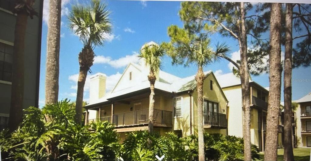 238 Afton Square, Unit 305 Altamonte Springs, FL 32714 - Photo 2 of 13 a view of a multi story residential apartment building with a yard and chandelier