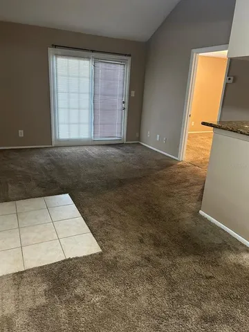 an empty room with an empty space and window