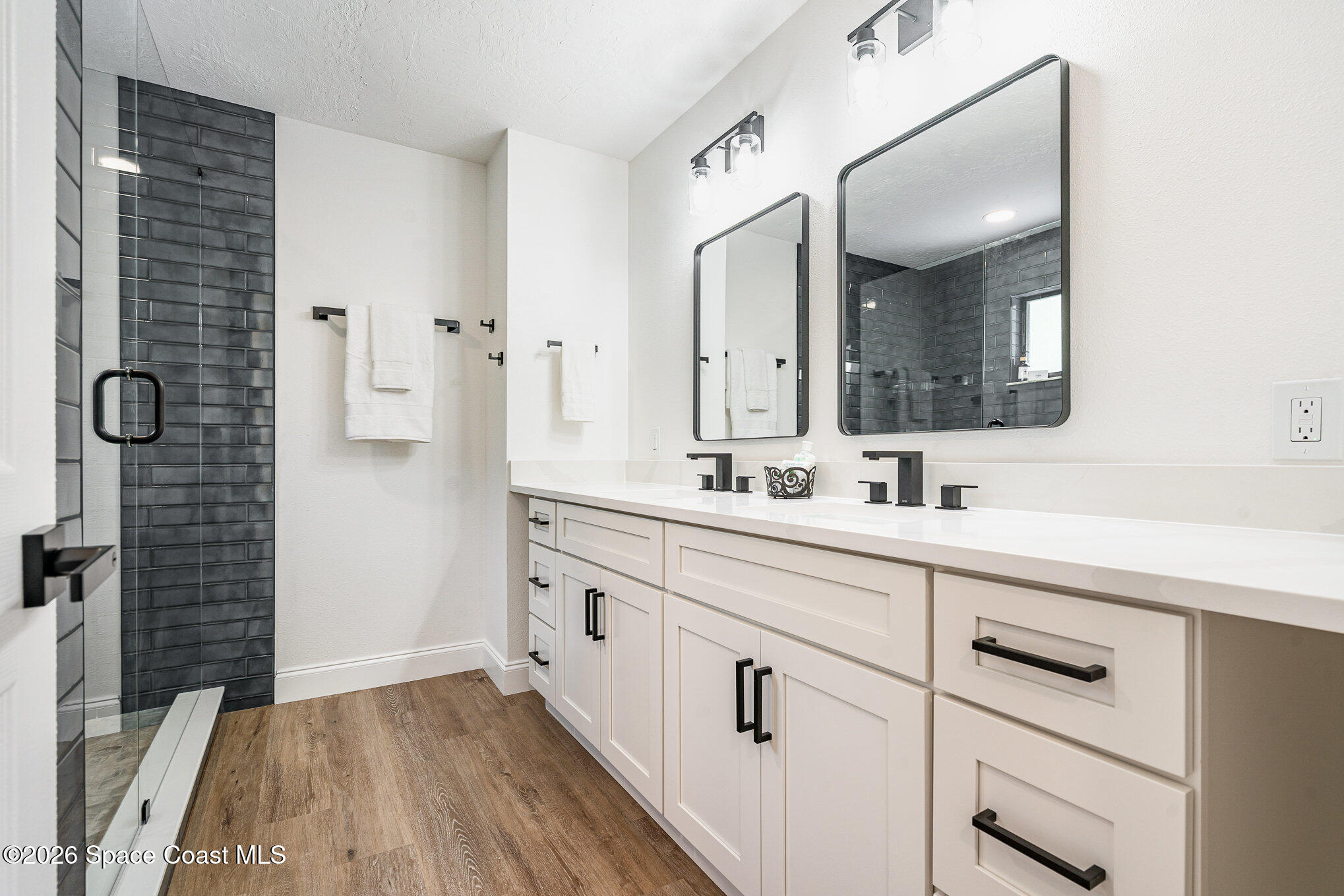 362 Nikomas Way Melbourne Beach, FL 32951 - Photo 14 of 32 a bathroom with a sink and a mirror