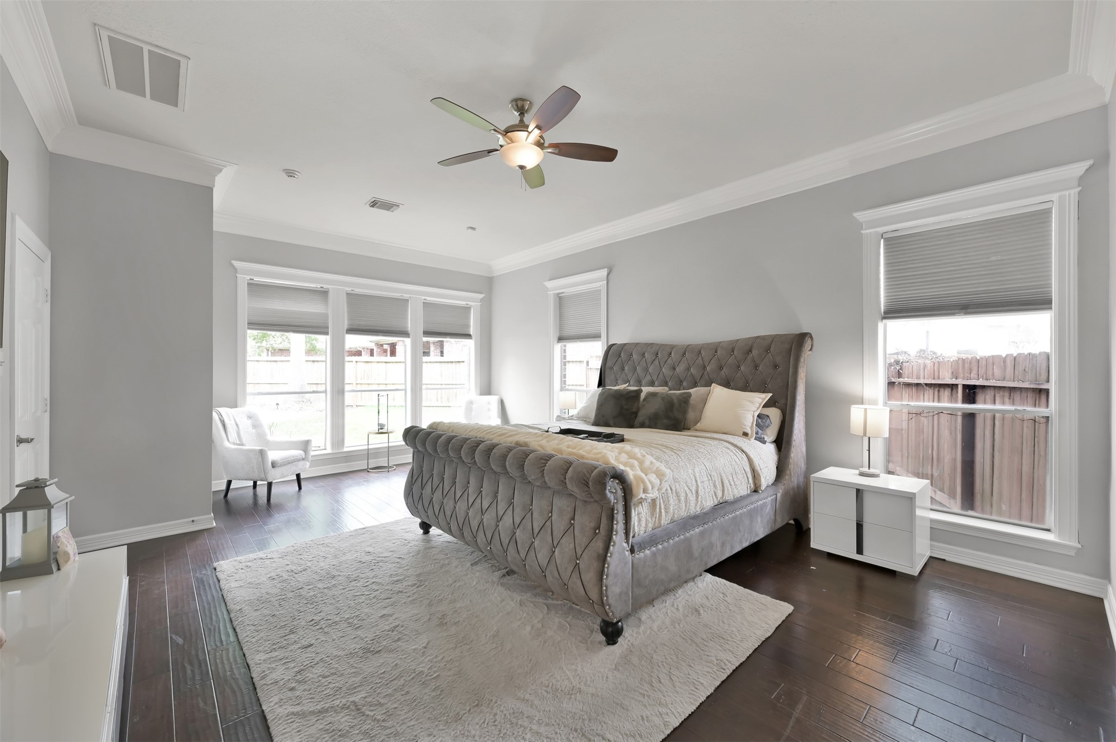 9706 Chipstead Court Spring, TX 77379 - Photo 24 of 44 This spacious bedroom not only accommodates a large bed but also features a cozy seating area, perfect for unwinding before bedtime.