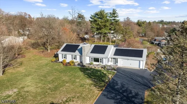 view of a house with a backyard