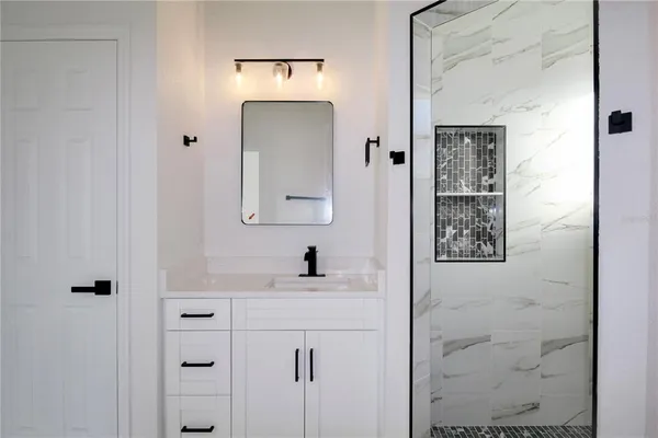a bathroom with a sink and a mirror