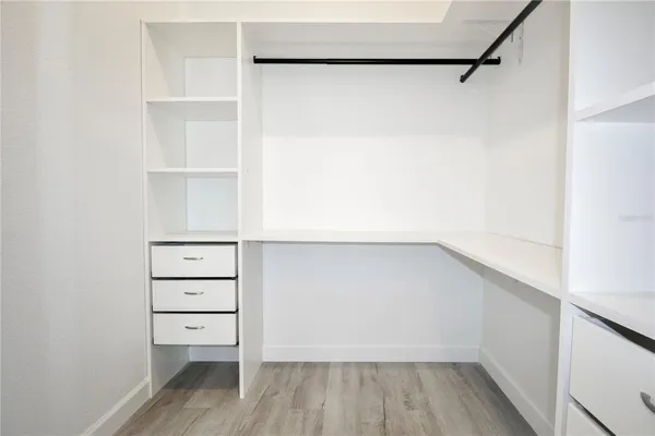 a view of an empty walk in closet
