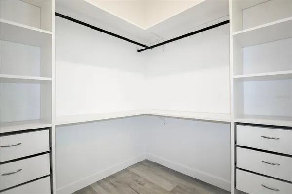 a view of an empty walk in closet
