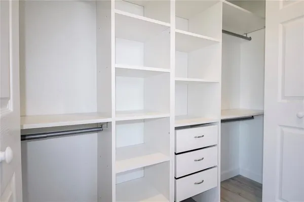 a view of an empty walk in closet