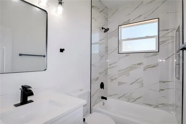 a bathroom with a sink and a shower