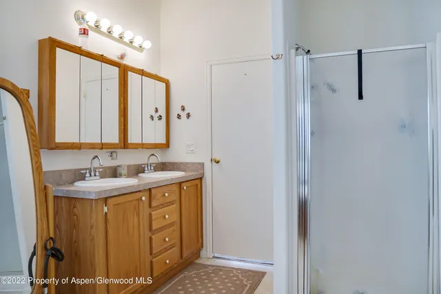 a kitchen with a sink appliances and cabinets