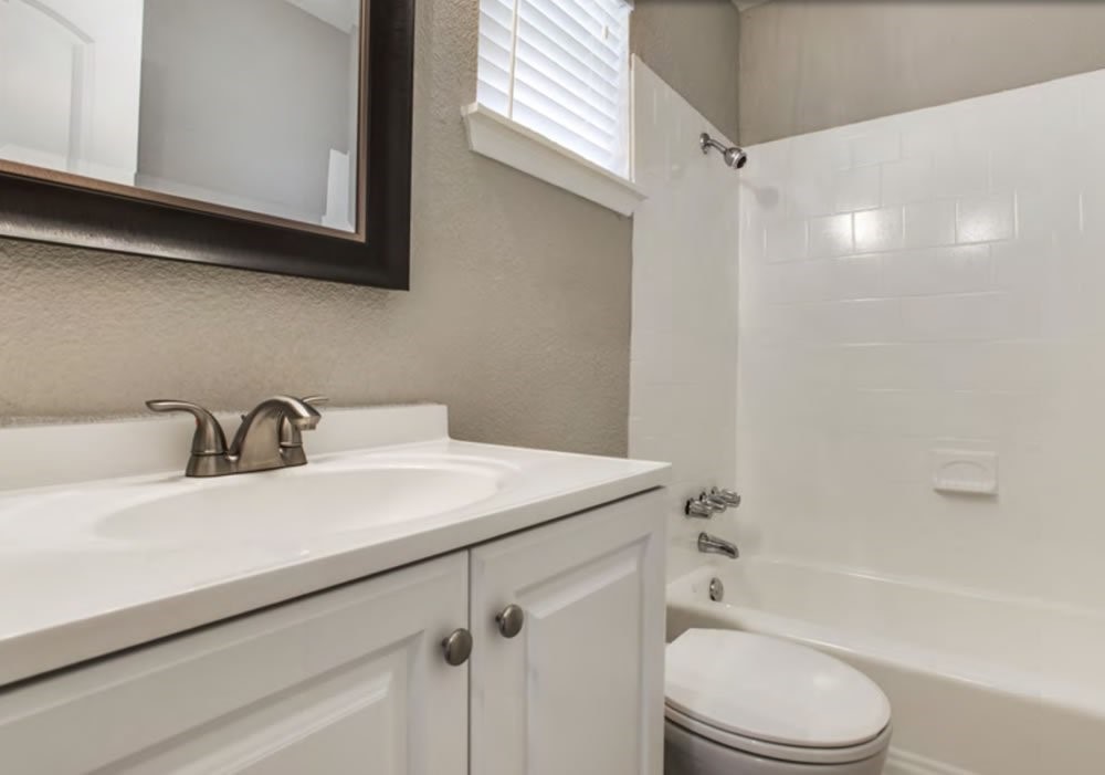 950 Live Oak Street Dallas, TX 75206 - Photo 3 of 6 a bathroom with a sink a toilet and shower