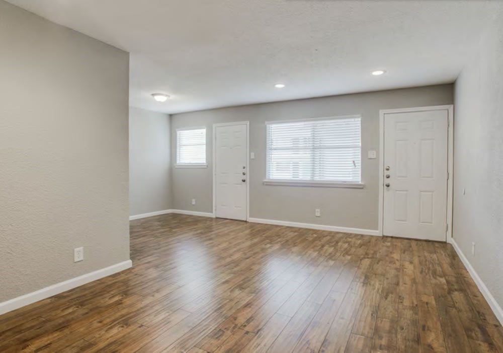 950 Live Oak Street Dallas, TX 75206 - Photo 6 of 6 an empty room with wooden floor and windows