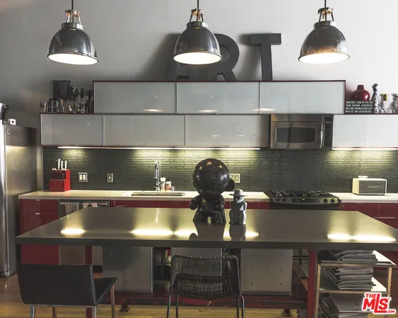 a kitchen with a table and chairs in it