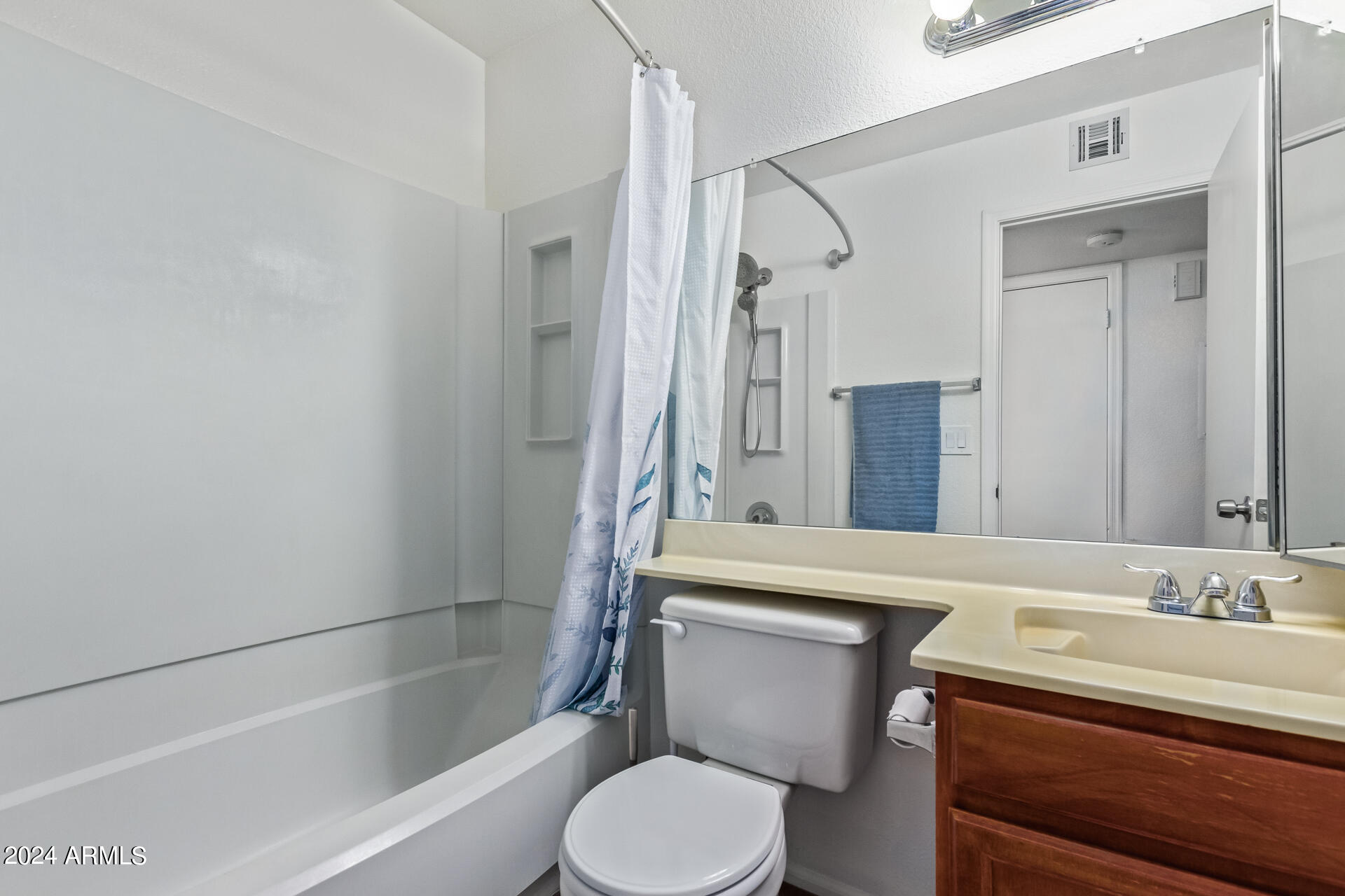533 West Guadalupe Road, Unit 2046 Mesa, AZ 85210 - Photo 20 of 29 a bathroom with a sink toilet vanity and shower