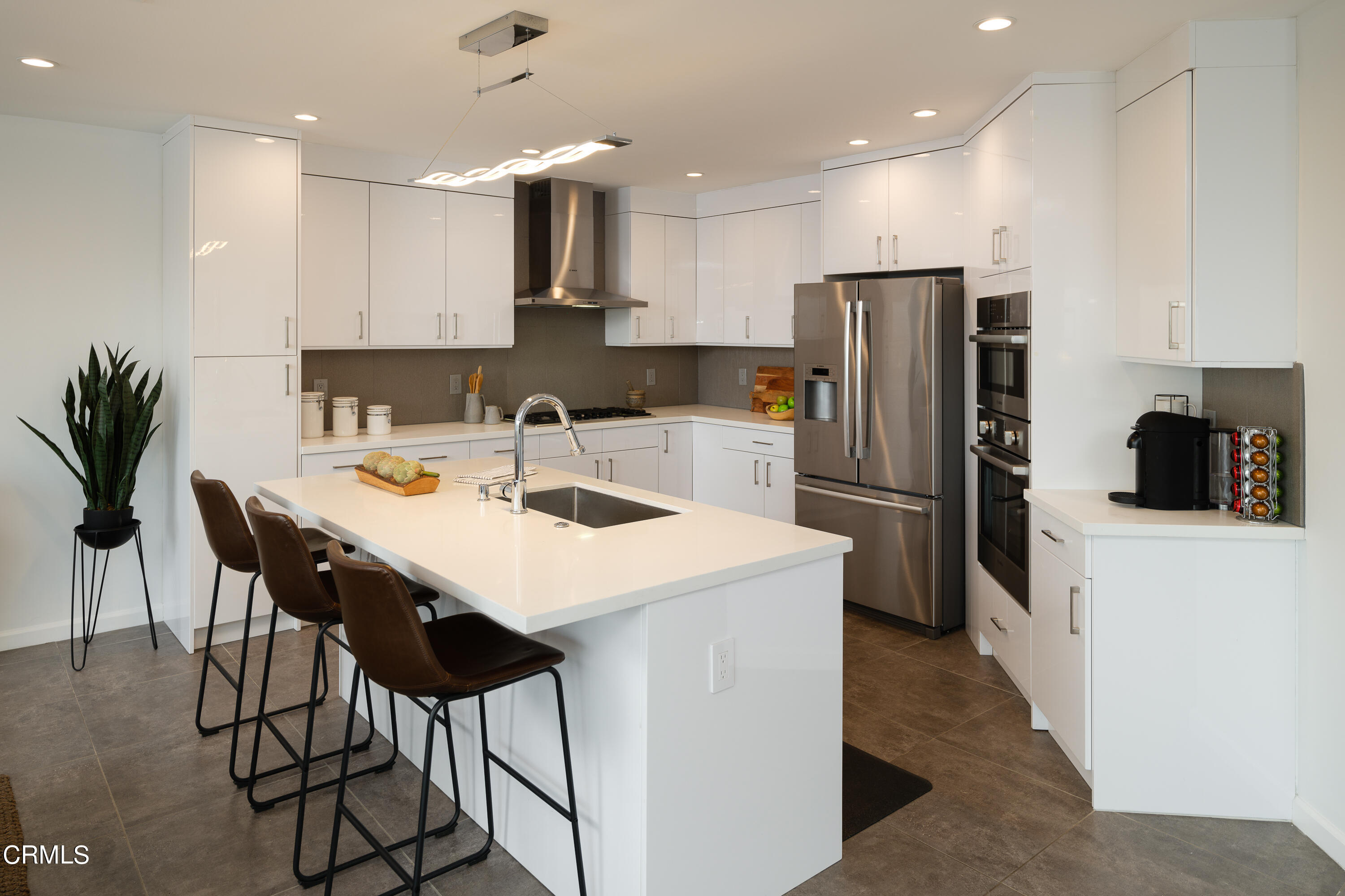 1020 Briarcliff Road Monrovia, CA 91016 - Photo 17 of 72 a kitchen that has a lot of cabinets a sink and appliances in it