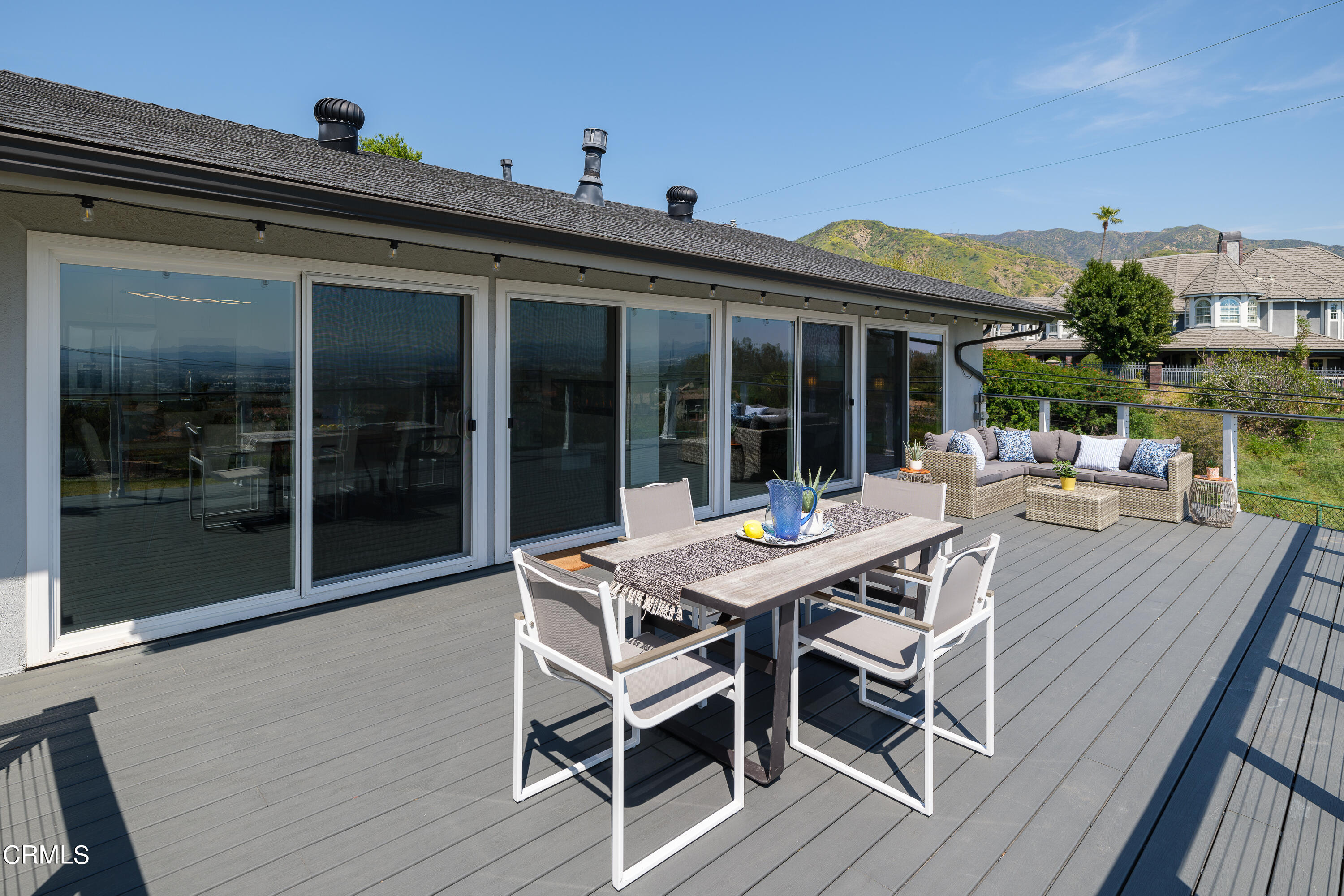 1020 Briarcliff Road Monrovia, CA 91016 - Photo 38 of 72 a view of a house with a deck and a dining table