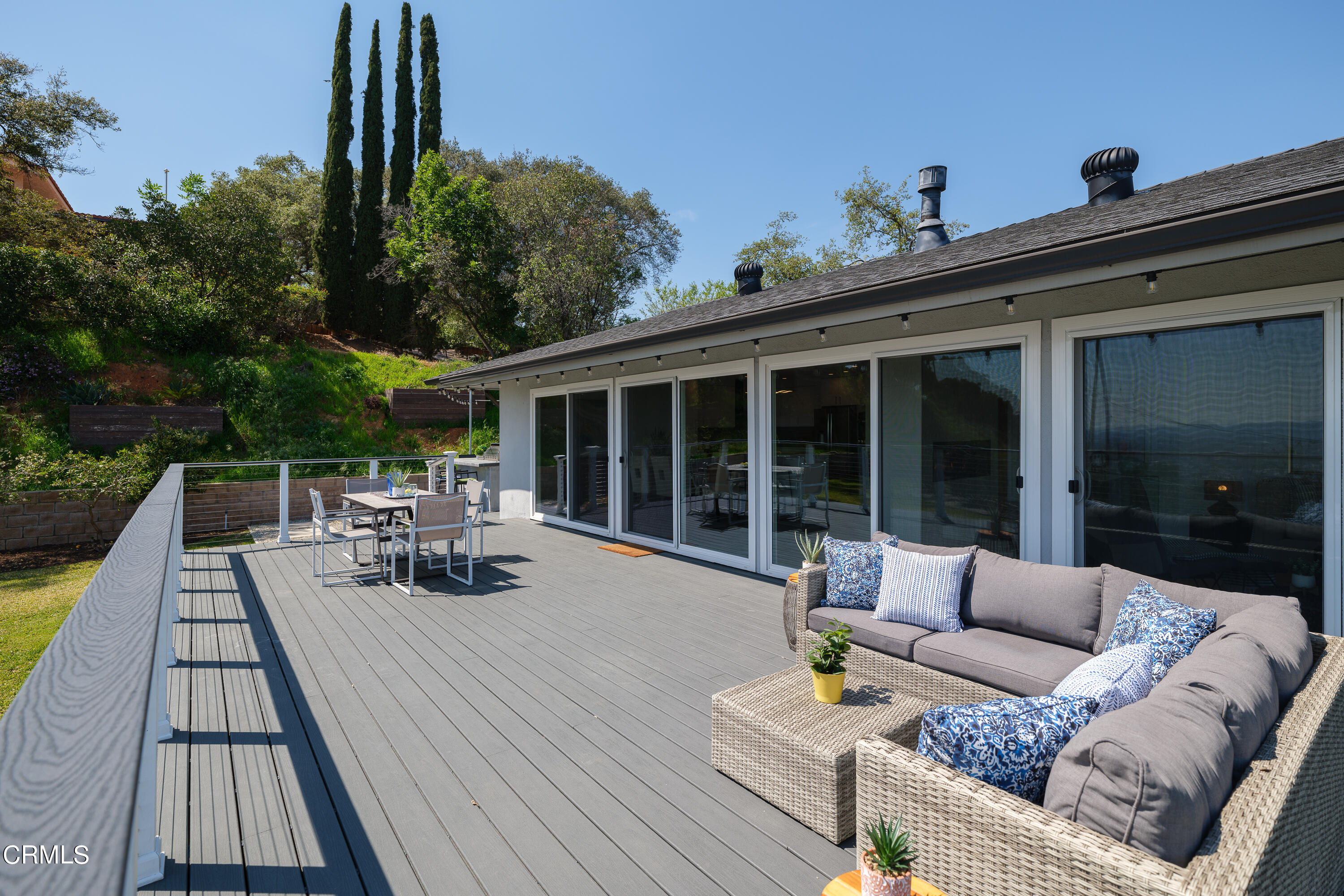 1020 Briarcliff Road Monrovia, CA 91016 - Photo 39 of 72 a view of a patio with couches table and chairs with wooden floor and fence