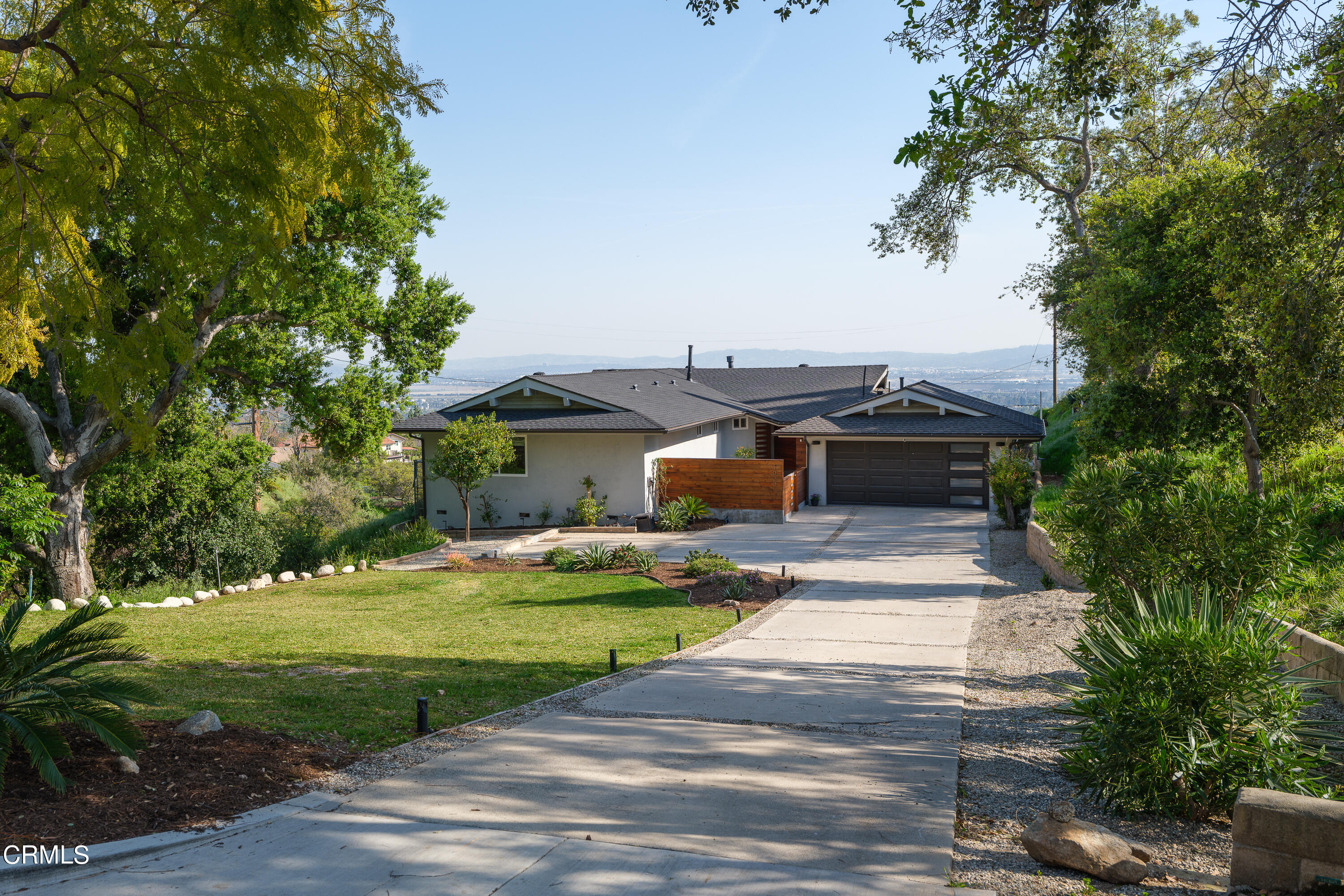 1020 Briarcliff Road Monrovia, CA 91016 - Photo 4 of 72 a front view of a house with a yard