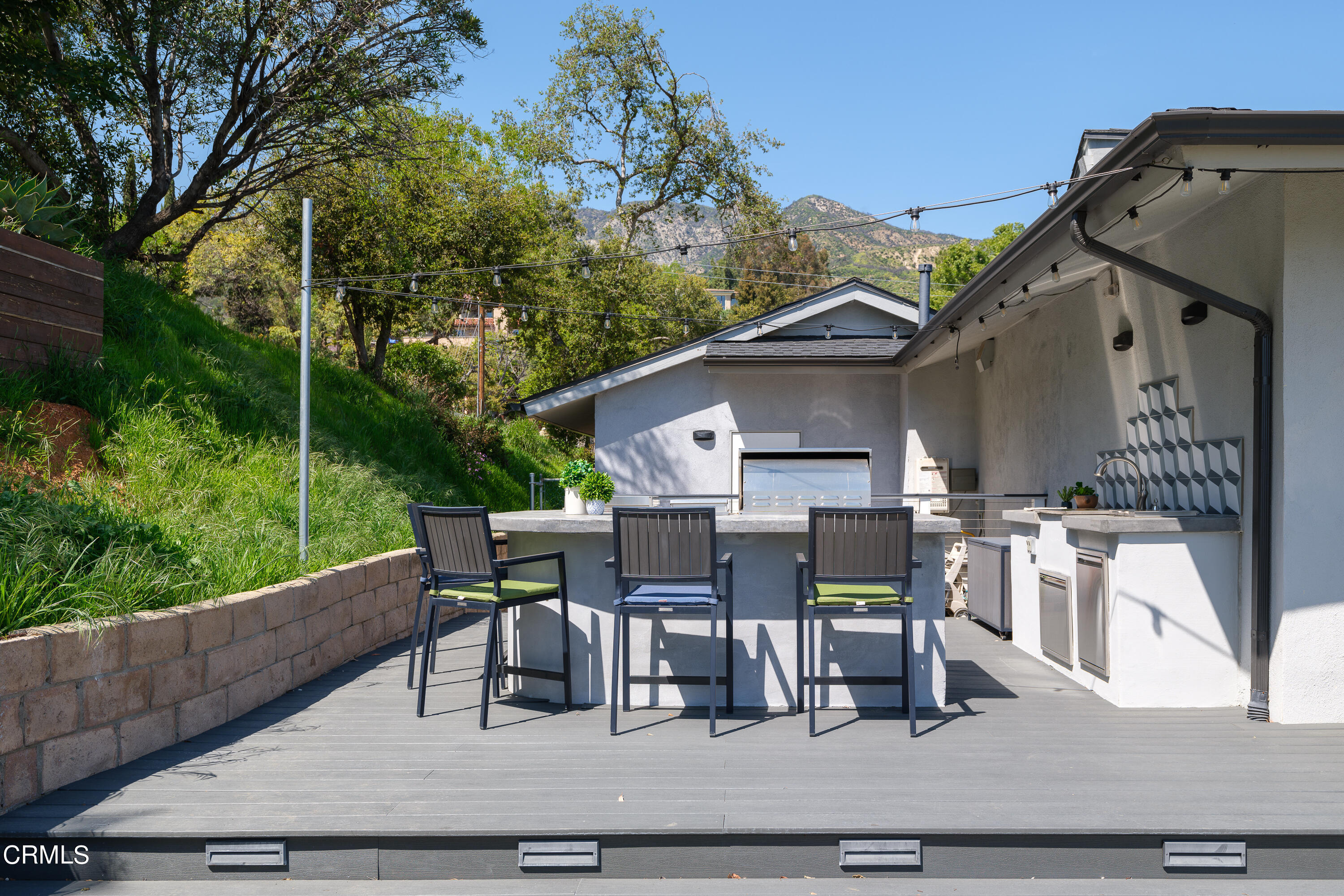 1020 Briarcliff Road Monrovia, CA 91016 - Photo 45 of 72 a view of a patio with table and chairs with wooden floor and fence