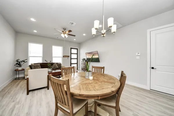 a view of a dining room with furniture and wooden floor