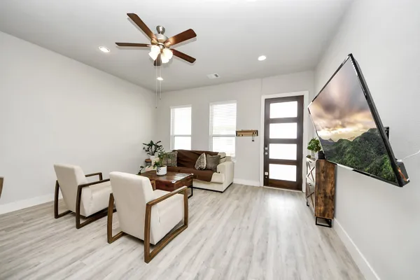 a living room with furniture and a large window