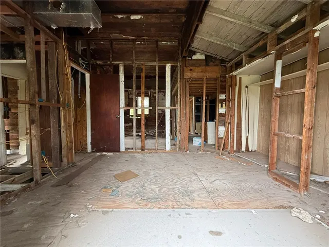 a view of a room with wooden walls