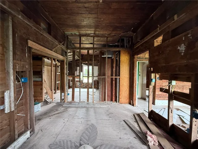 a view of a porch with wooden floor