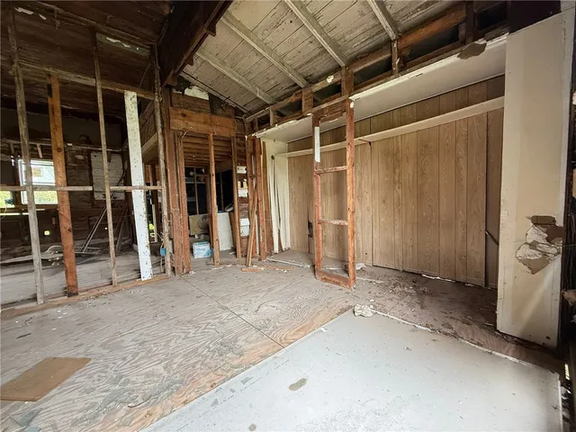 a view of a room with wooden walls