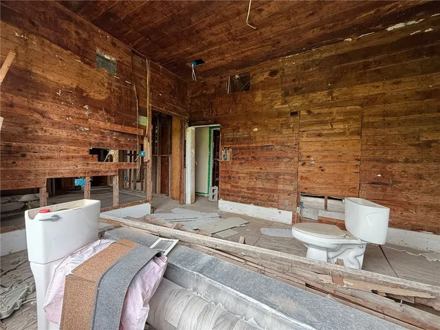 a bed room with a bed and a couch