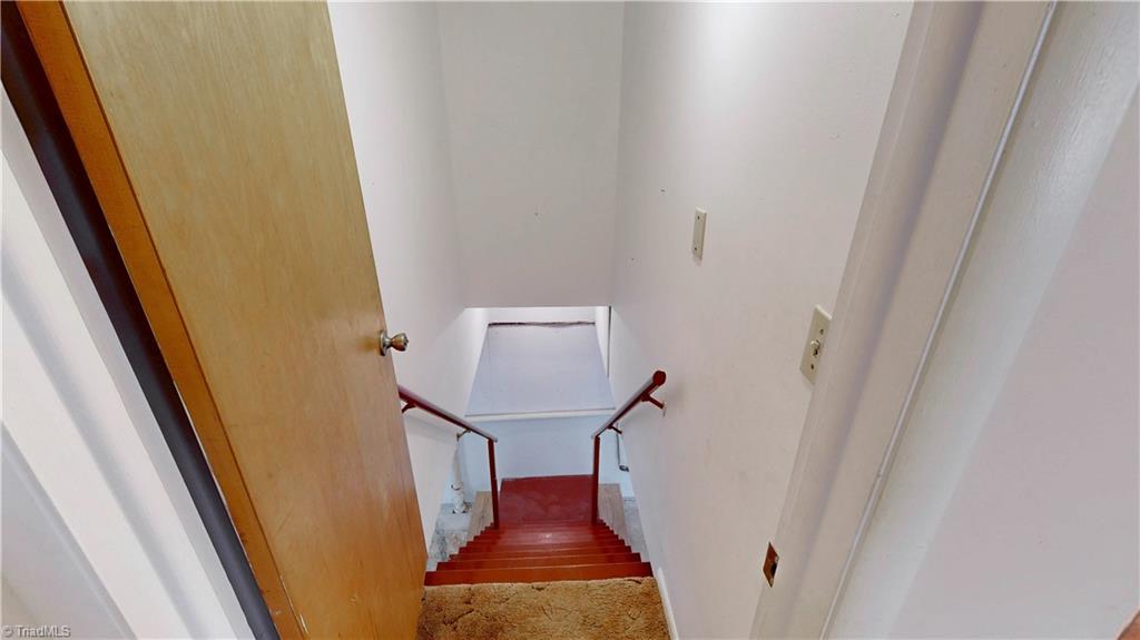 6919 East Holly Grove Road Thomasville, NC 27360 - Photo 43 of 50 Inside stairs to basement