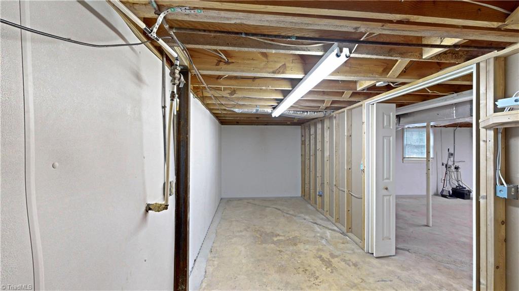 6919 East Holly Grove Road Thomasville, NC 27360 - Photo 48 of 50 Basement storage