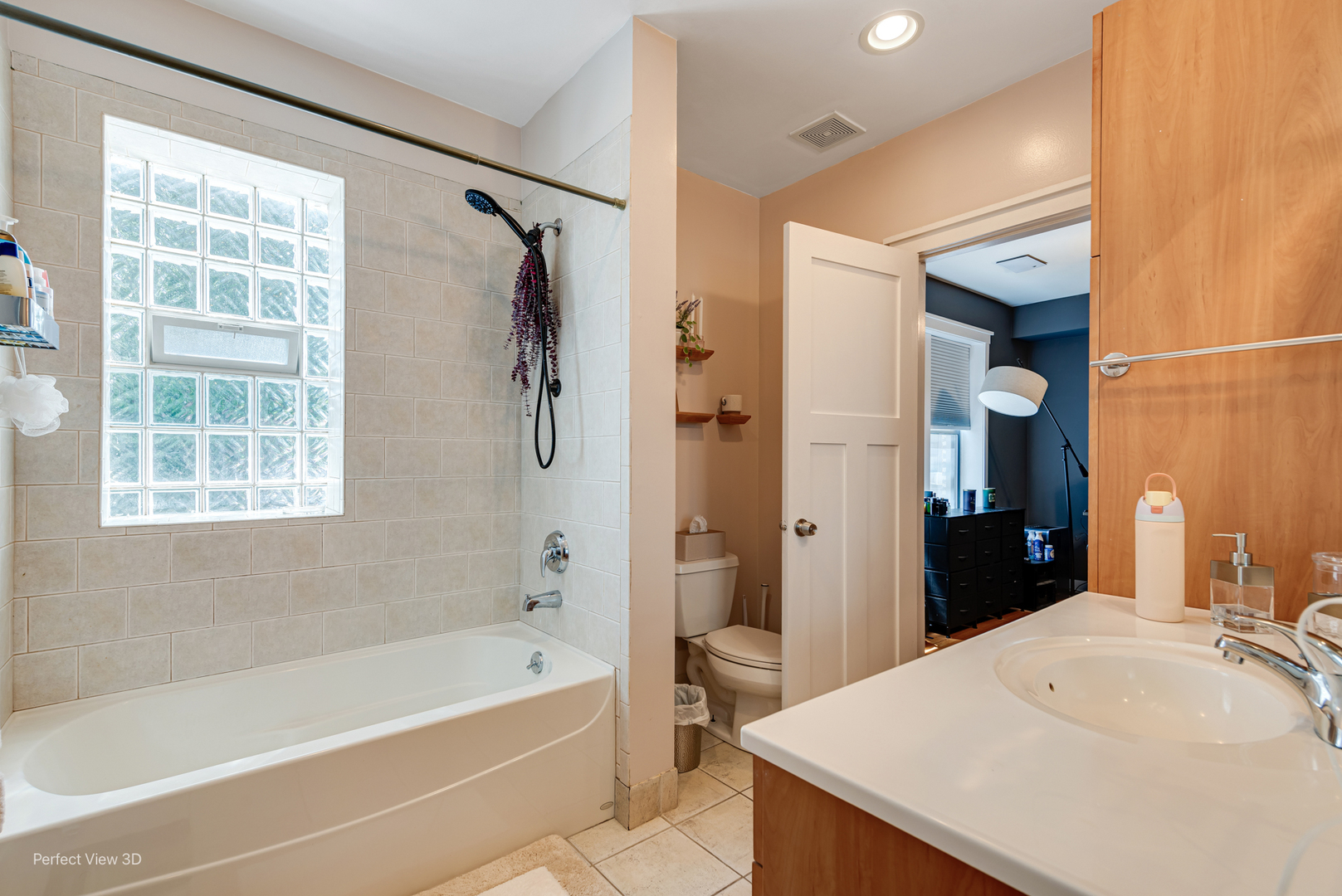 2111 West Arthur Avenue, Unit 1S Chicago, IL 60645 - Photo 11 of 27 a bathroom with a bathtub shower sink and mirror