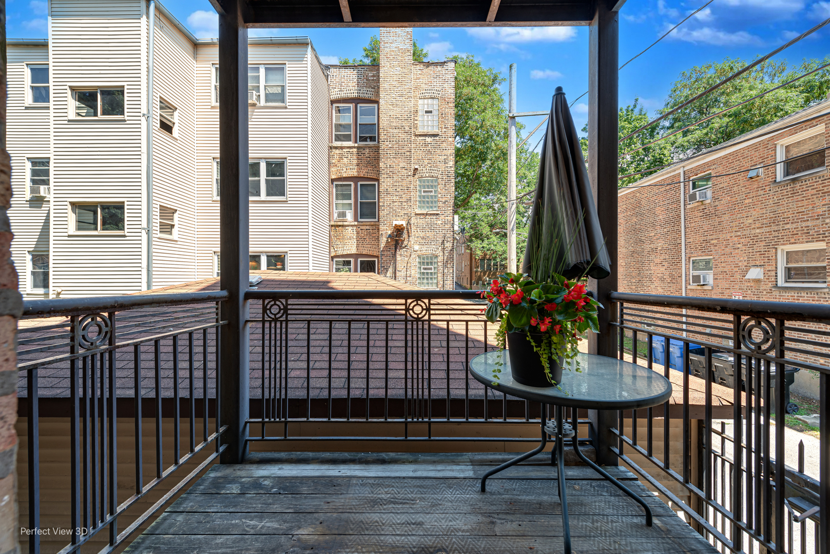 2111 West Arthur Avenue, Unit 1S Chicago, IL 60645 - Photo 17 of 27 a view of a balcony with chairs and wooden floor