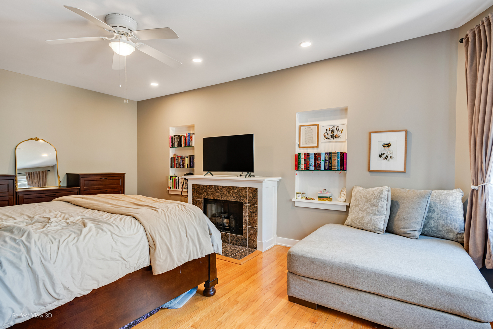 2111 West Arthur Avenue, Unit 1S Chicago, IL 60645 - Photo 4 of 27 a spacious bedroom with a bed and a flat screen tv