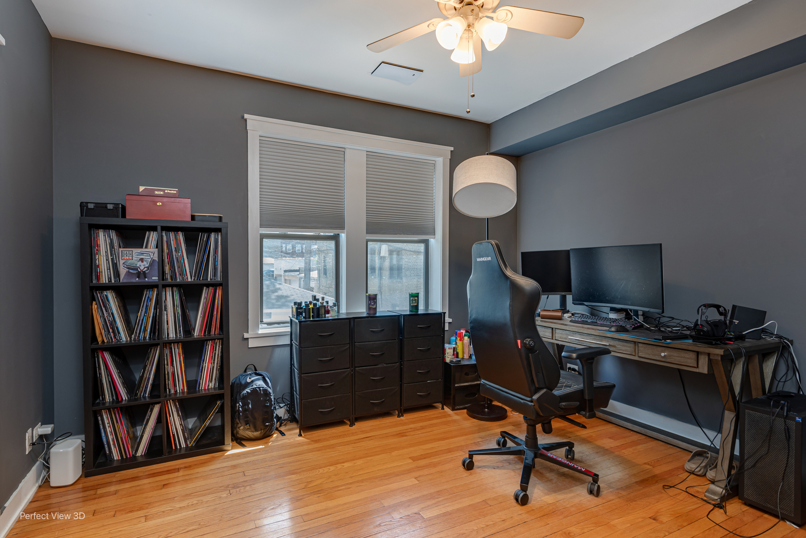 2111 West Arthur Avenue, Unit 1S Chicago, IL 60645 - Photo 9 of 27 a view of a workspace with furniture and a bookshelf