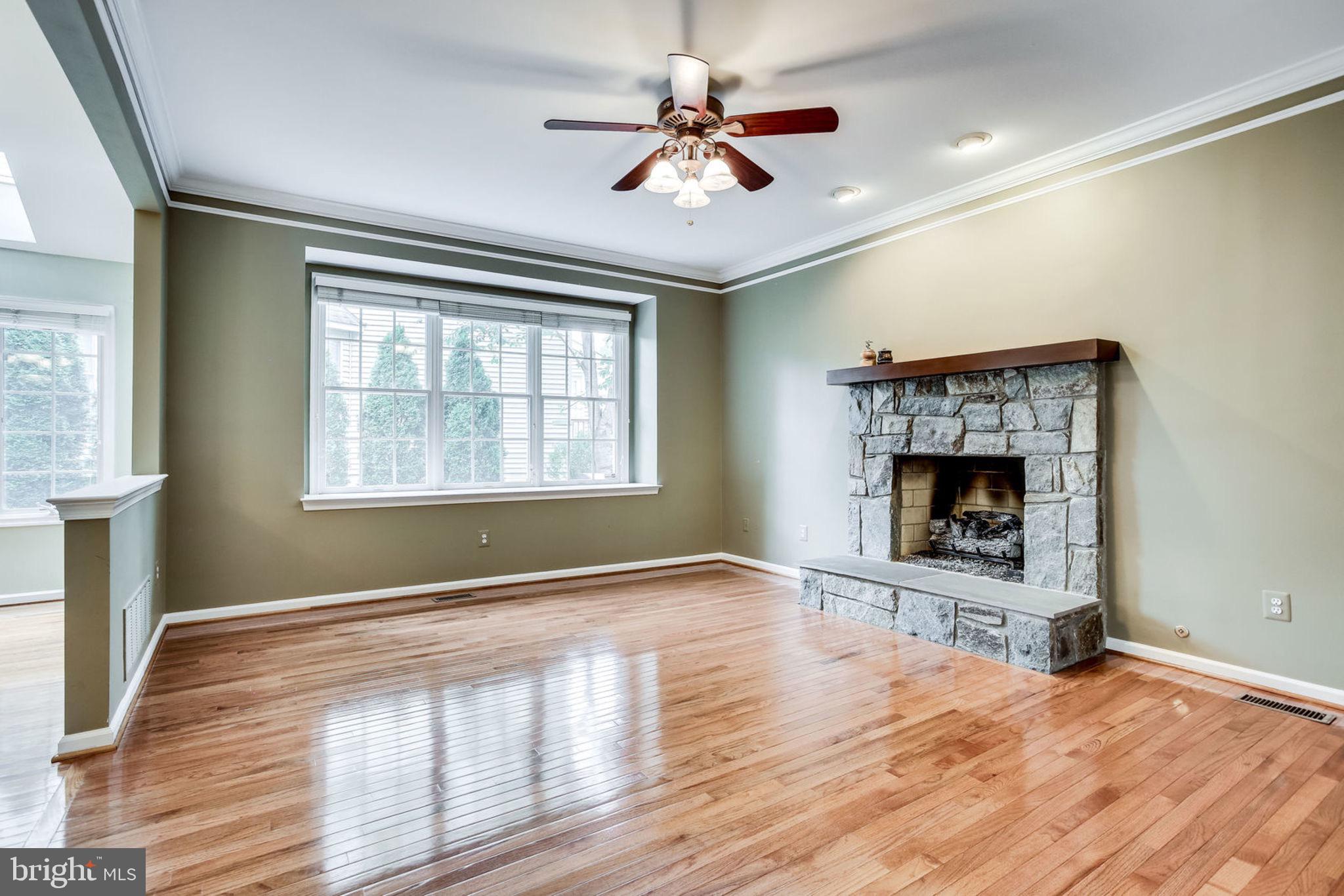 10851 Grovehampton Court Reston, VA 20194 - Photo 18 of 49 a view of an empty room with a window and wooden floor