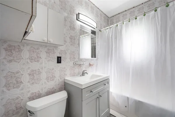 a bathroom with a sink a vanity and a mirror