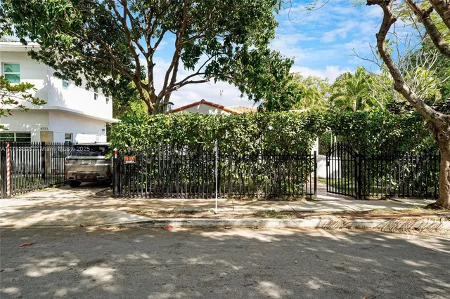 a living room with furniture rug and wooden floor