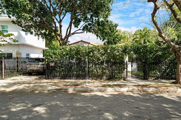 a living room with furniture rug and wooden floor