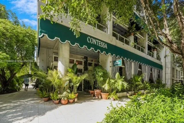 a view of street with parked cars