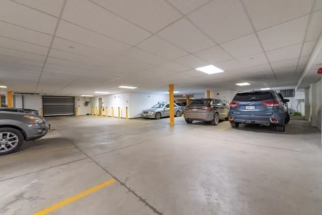 a view of parking space with parked cars