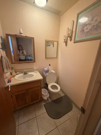 a view of a room that has a window and a table