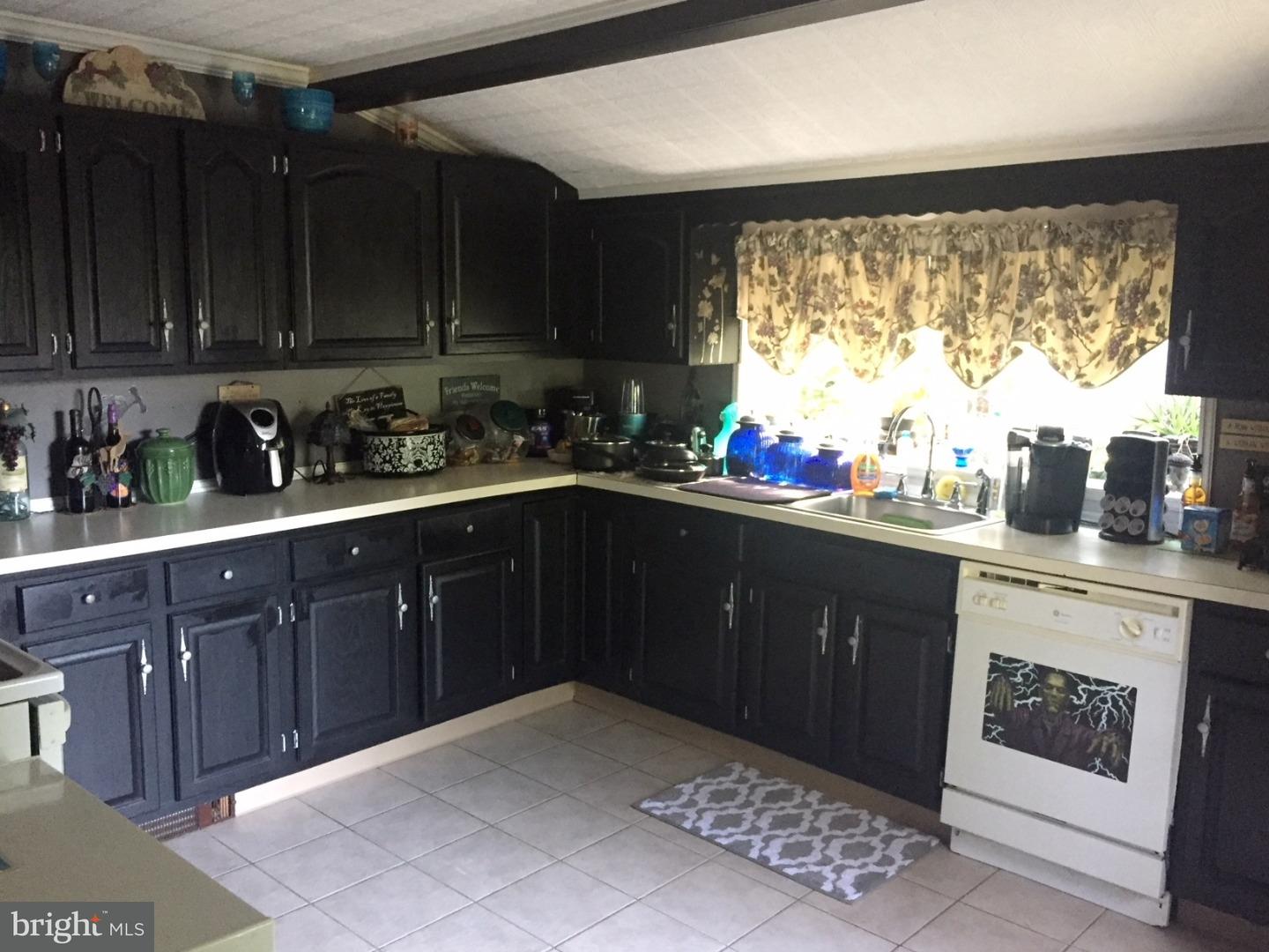 1392 Hedding Jacksonville Road Columbus, NJ 08022 - Photo 7 of 15 a kitchen with a sink stove and cabinets