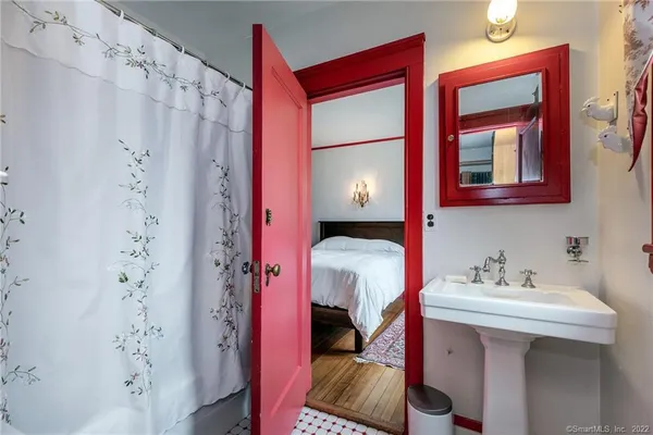 a bathroom with a sink and a mirror