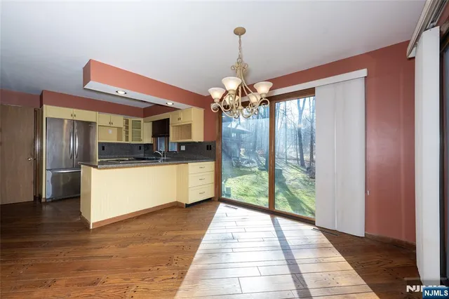 a view of a kitchen with a sink and dishwasher in kitchen