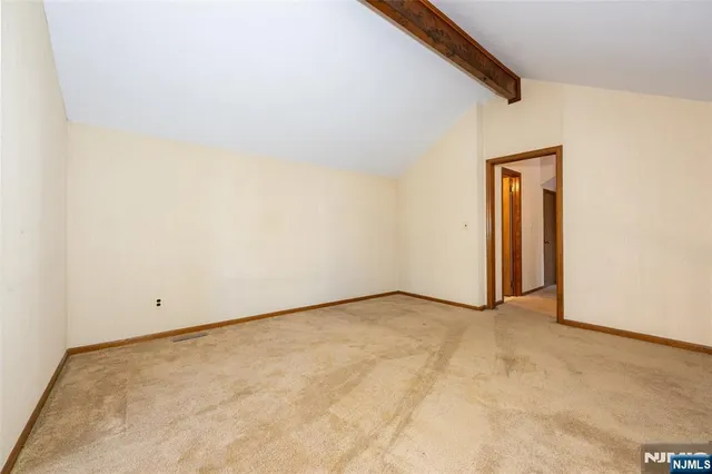 an empty room with a bench