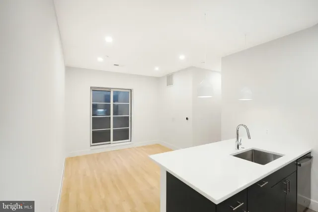 a kitchen with a sink and a window