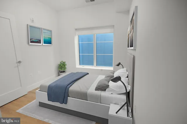 a bedroom with a bed and window