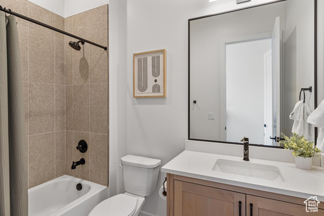 5367 Cyan Lane St. George, UT 84790 - Photo 32 of 36 Full bathroom featuring toilet, shower / tub combo with curtain, and vanity