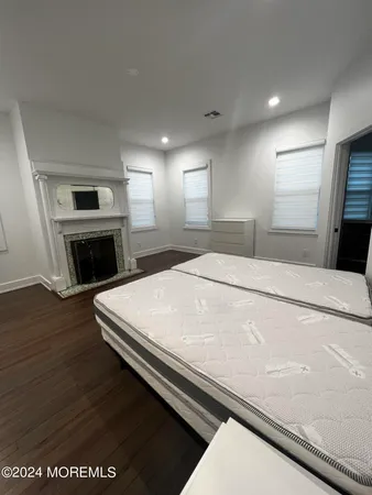 a bedroom with a bed and a television